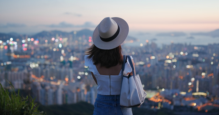 Woman Look at the Beautiful City View at Sunset